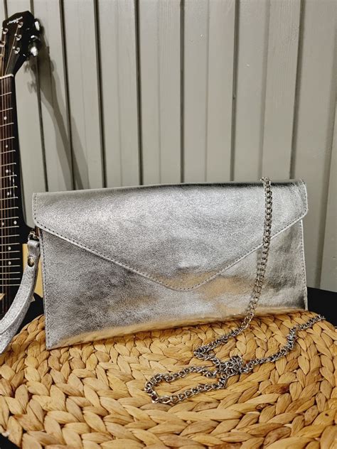 metallic silver clutch bag